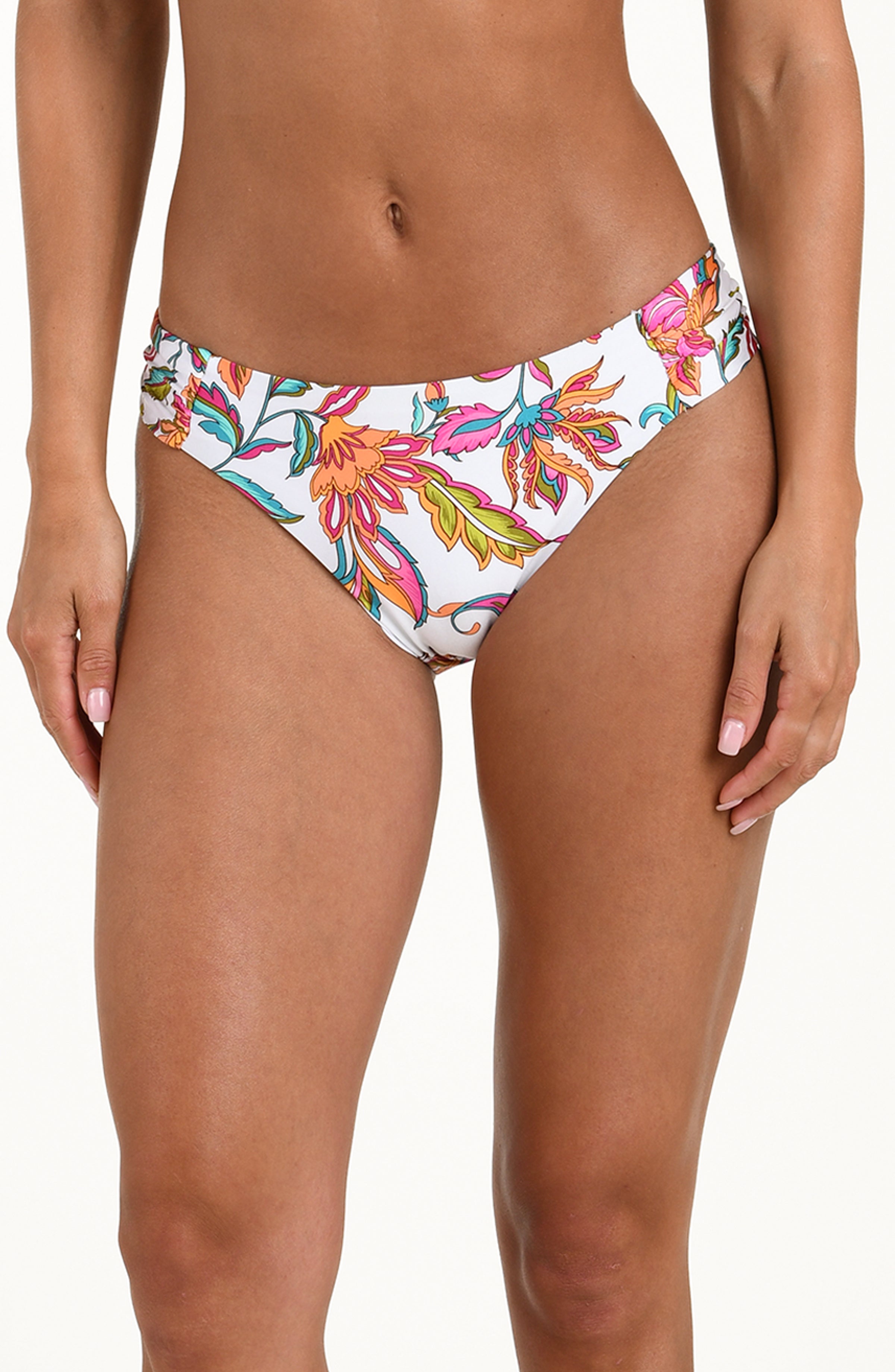 Floral-patterned bikini bottom worn by a person on a white background