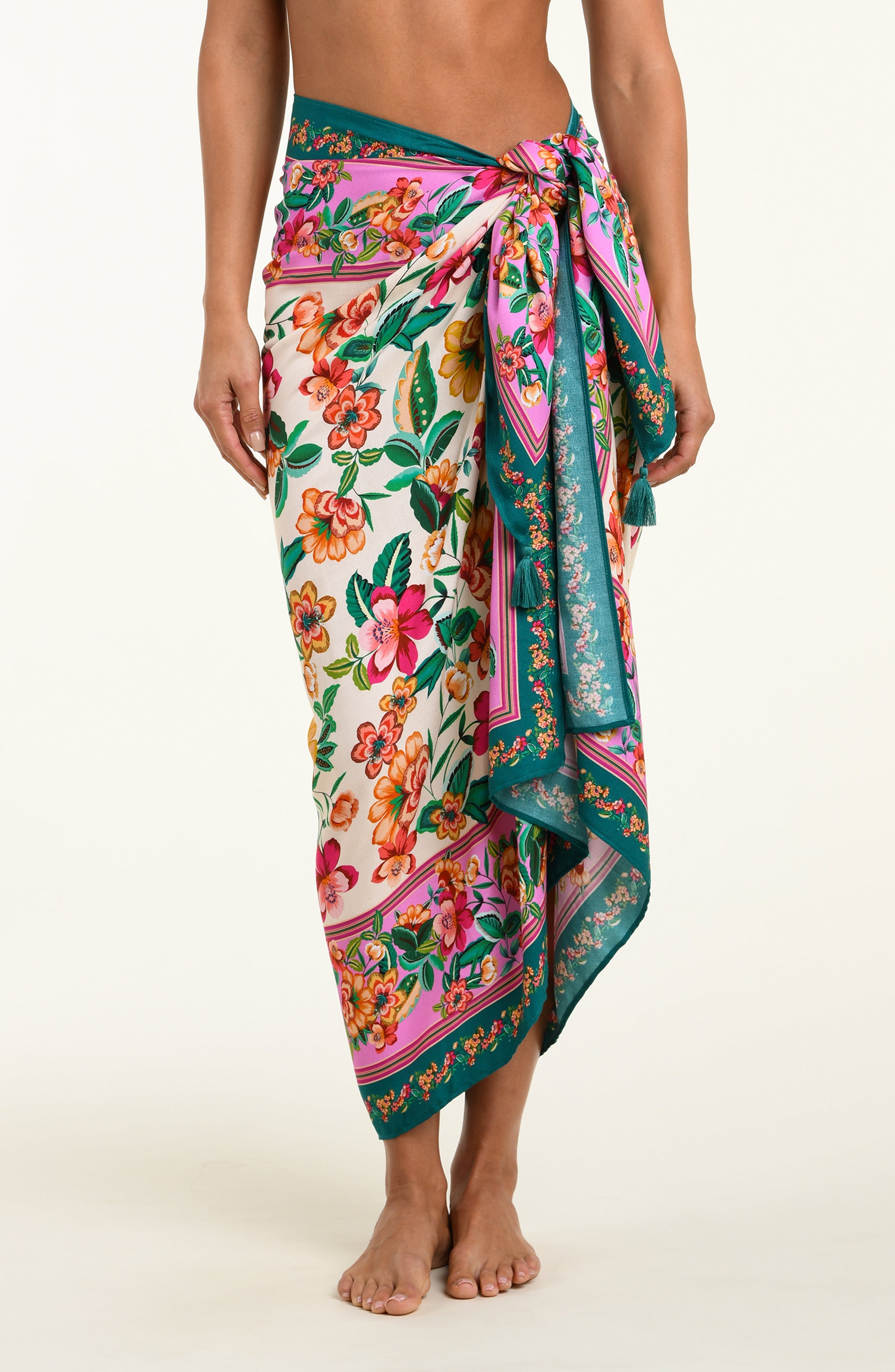 Floral patterned sarong being worn by a person on a white background