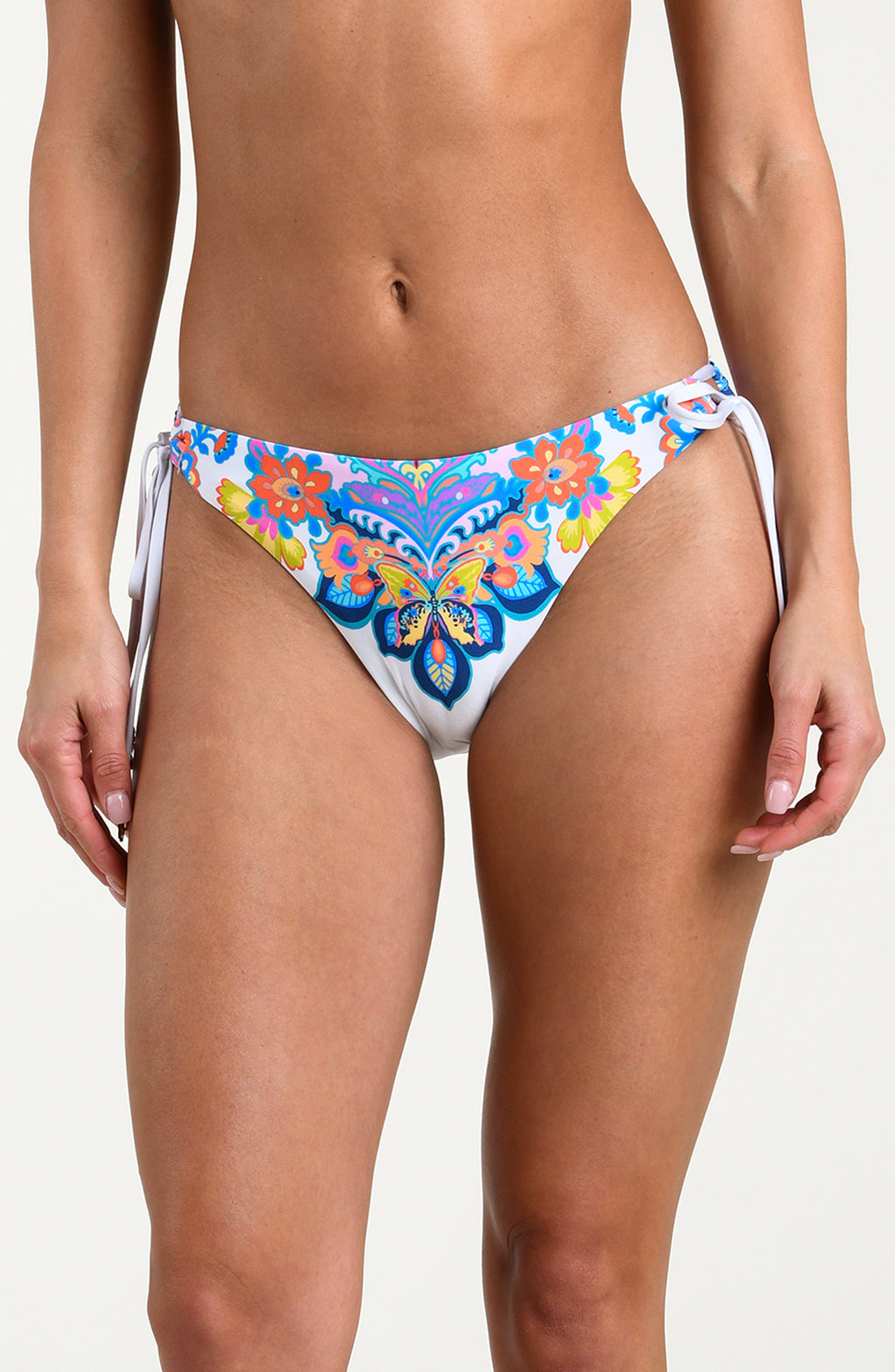 Woman wearing a multicolored bikini bottom against a white background.