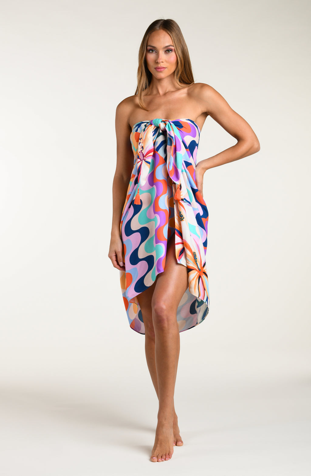 Multicolored patterned sarong being worn by a person on a white background