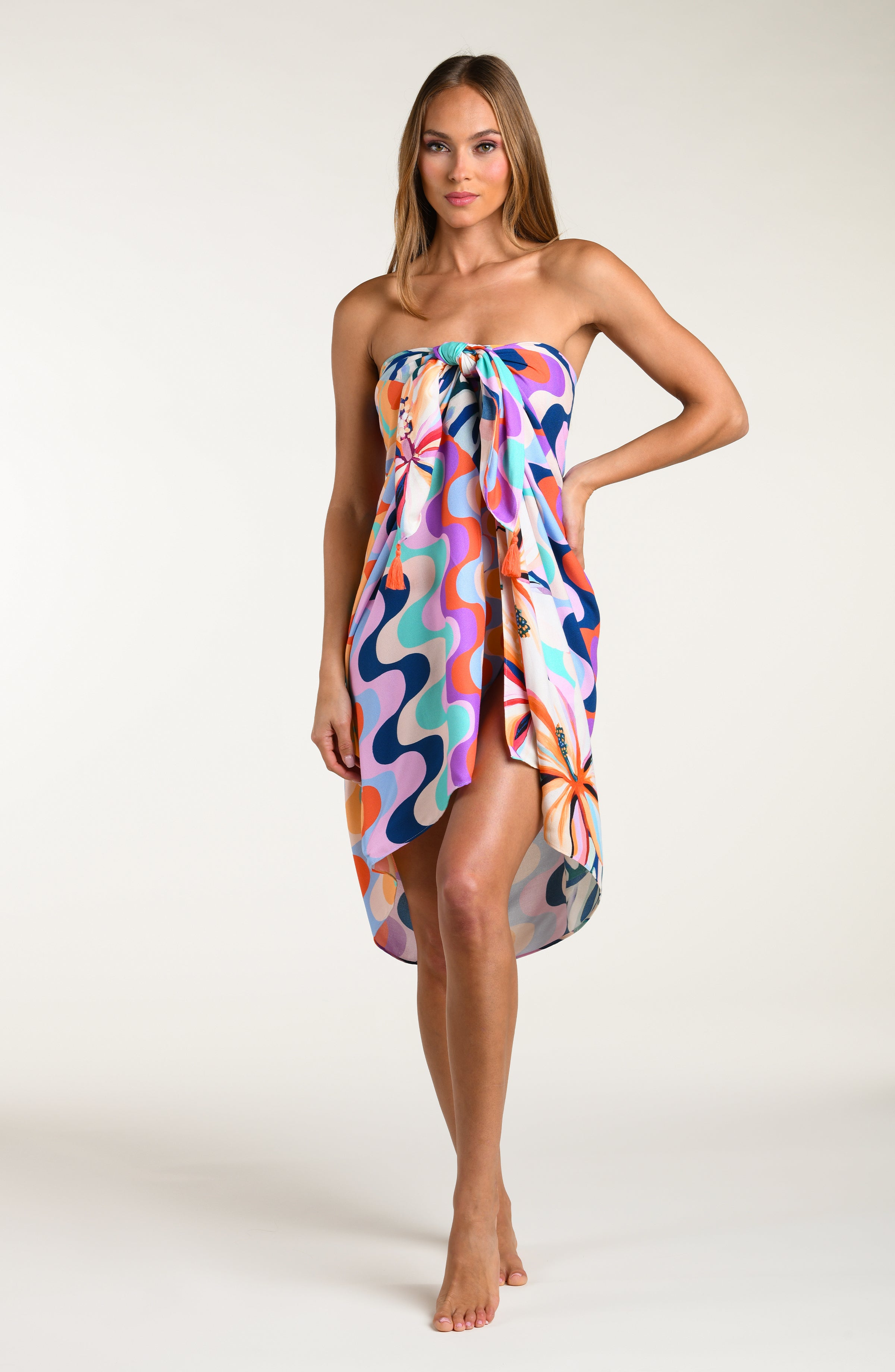 Multicolored patterned sarong being worn by a person on a white background