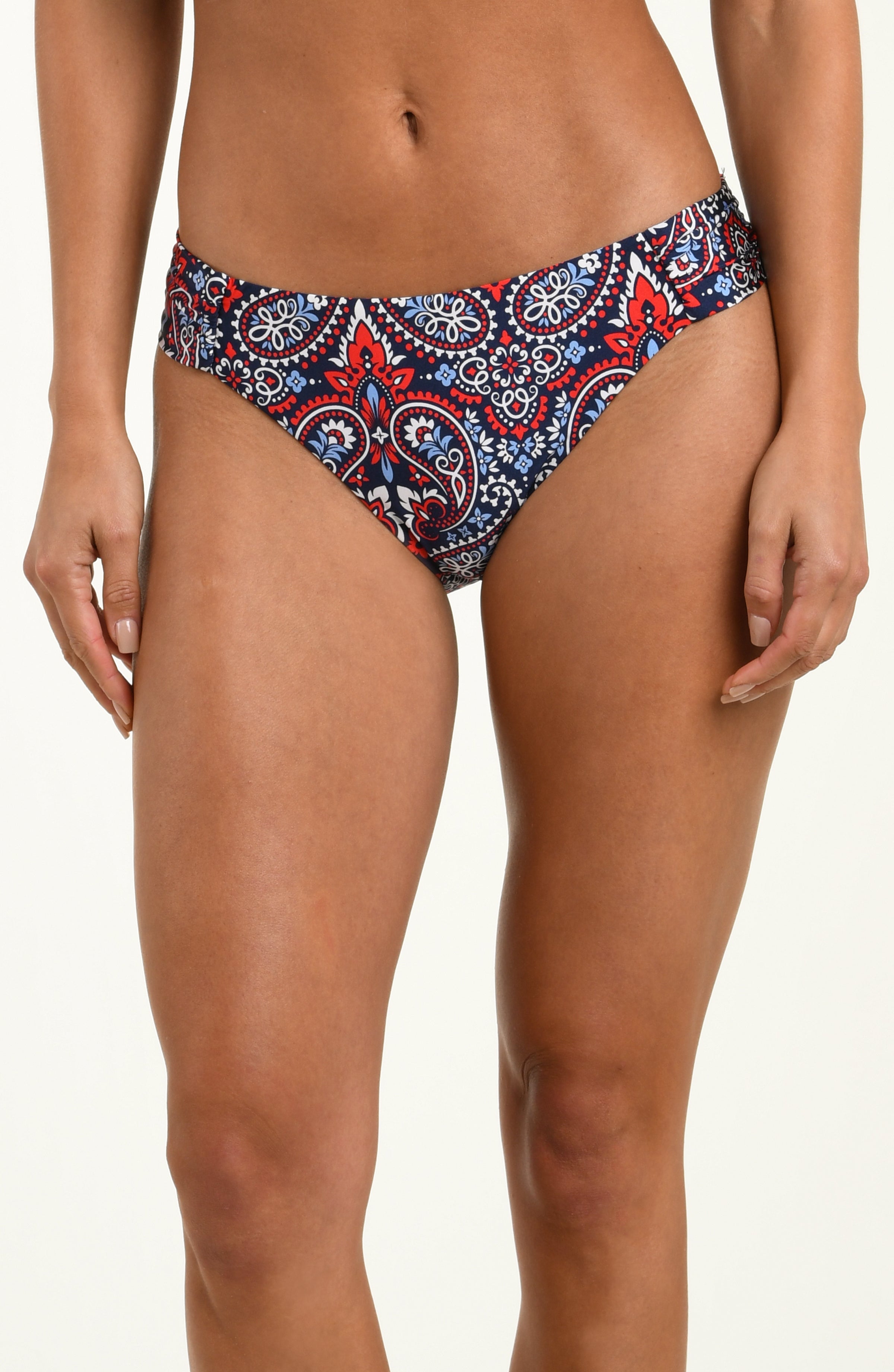 Patterned bikini bottom worn by a person on a plain background
