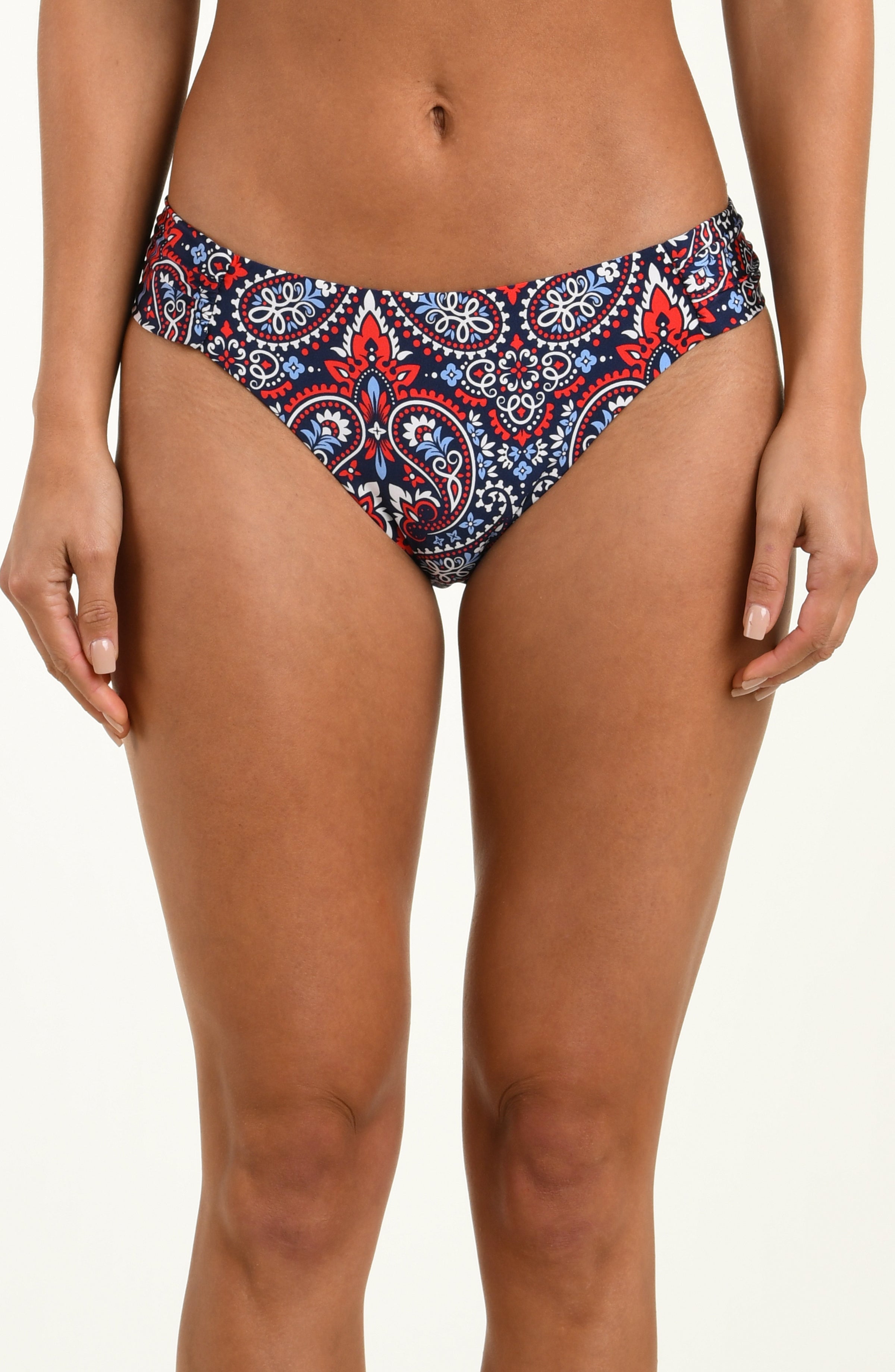Patterned bikini bottom worn by a person on a plain background
