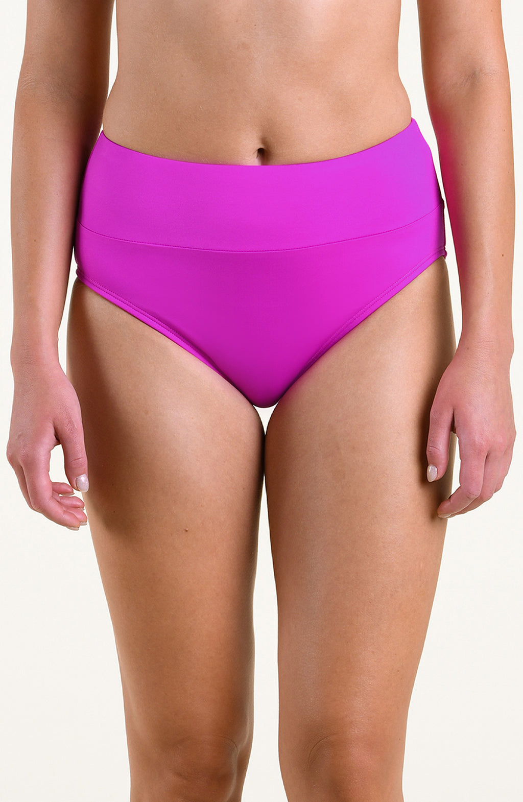 A model wearing bright orchid high-waisted bikini bottoms against a plain light background.