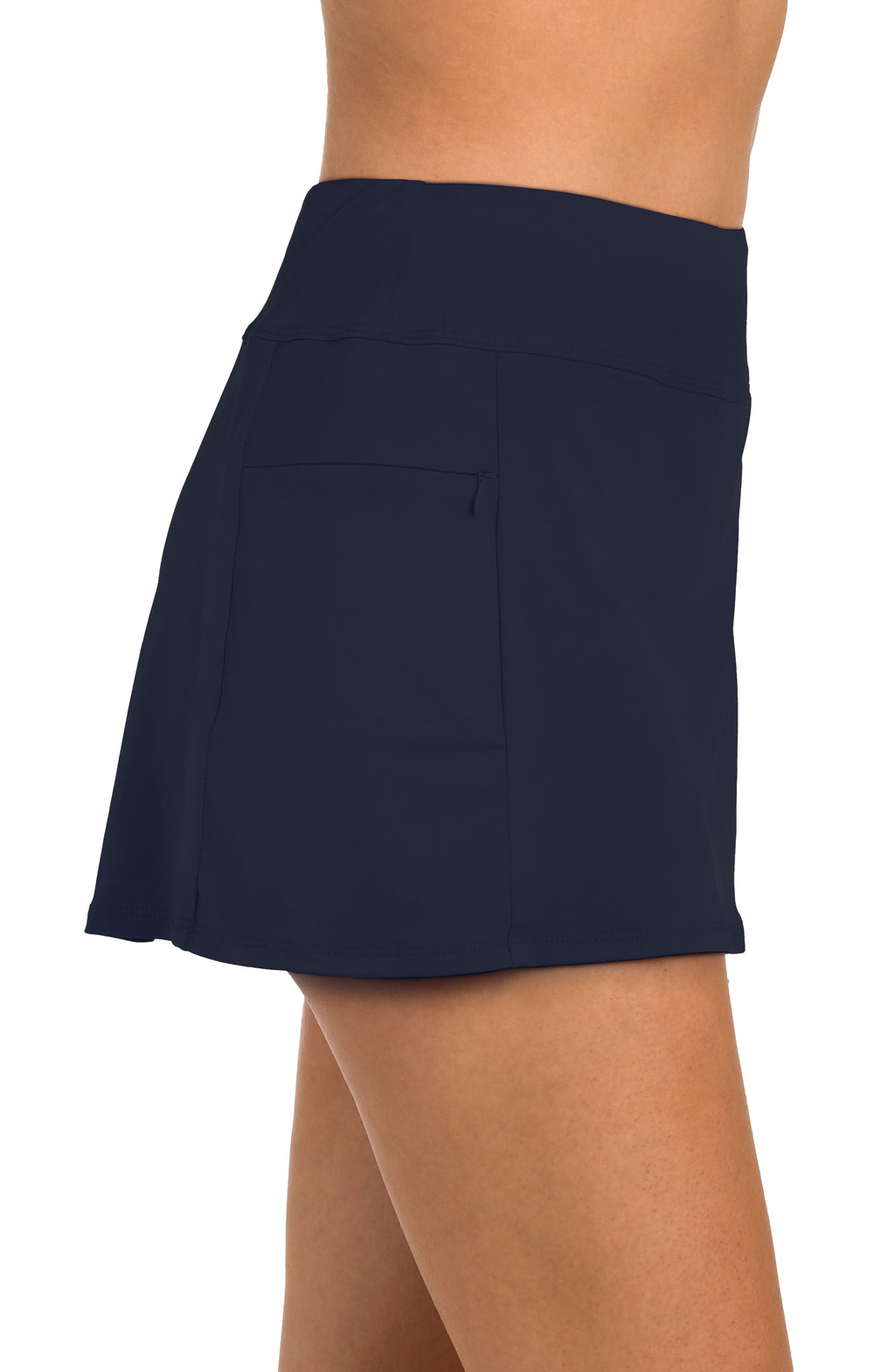 Navy blue swim skort worn by a person on a white background