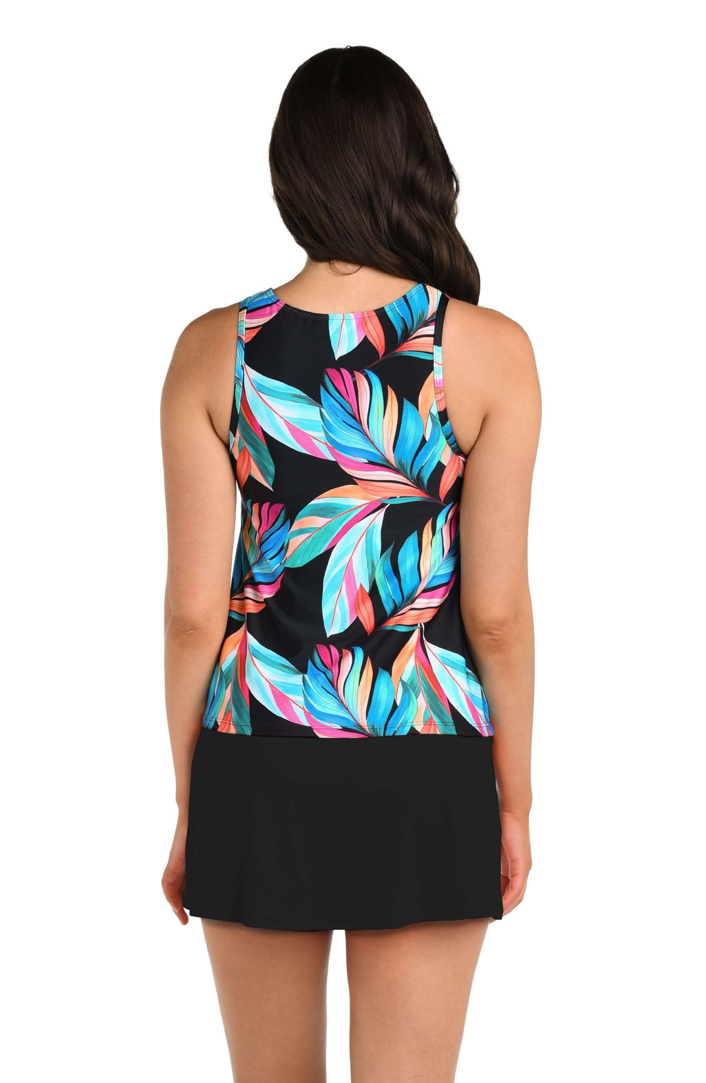 Woman wearing a multicolored tankini top with colorful leaf pattern on a black background