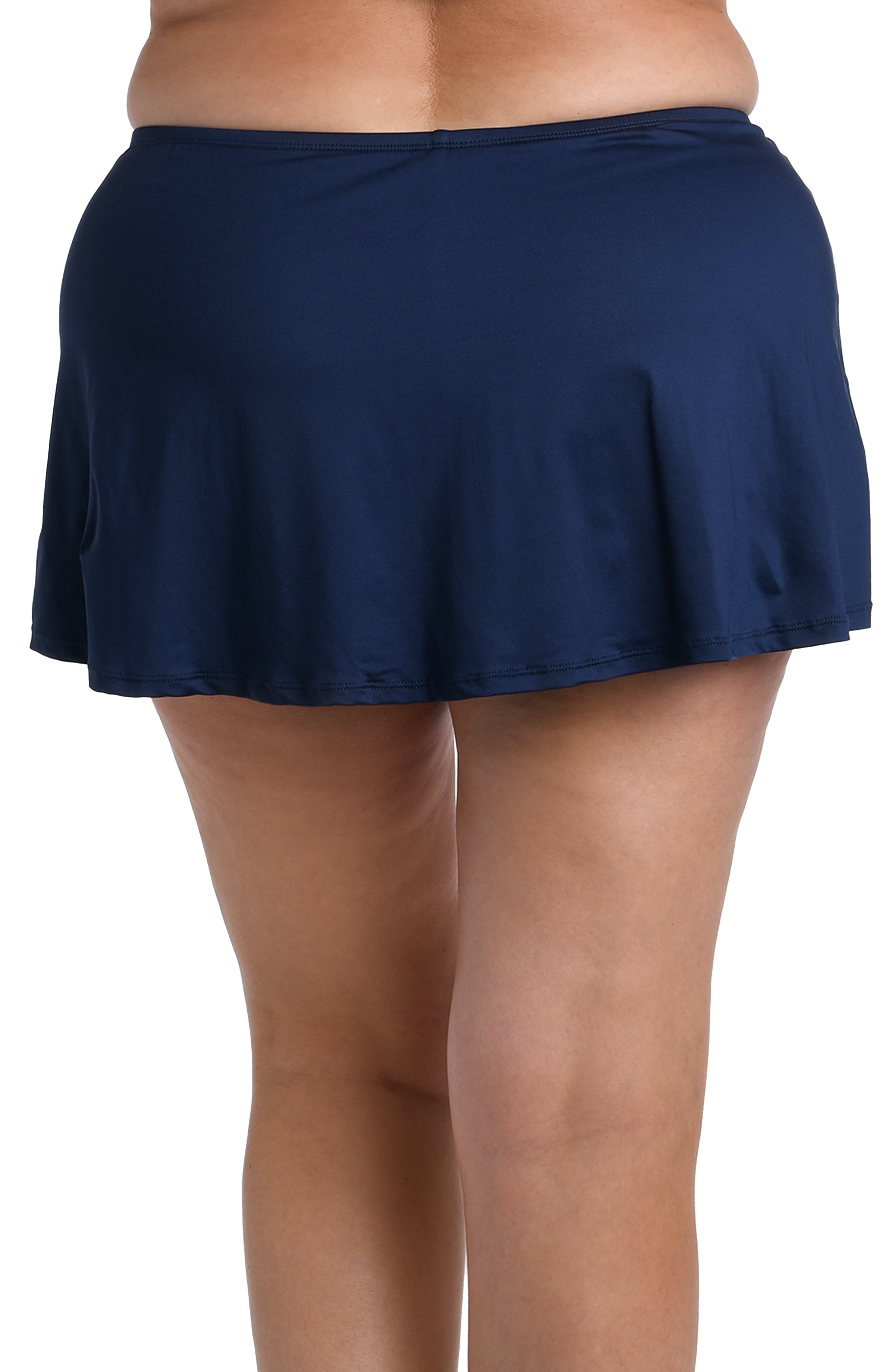 Navy blue swim skirt worn by a person on a white background