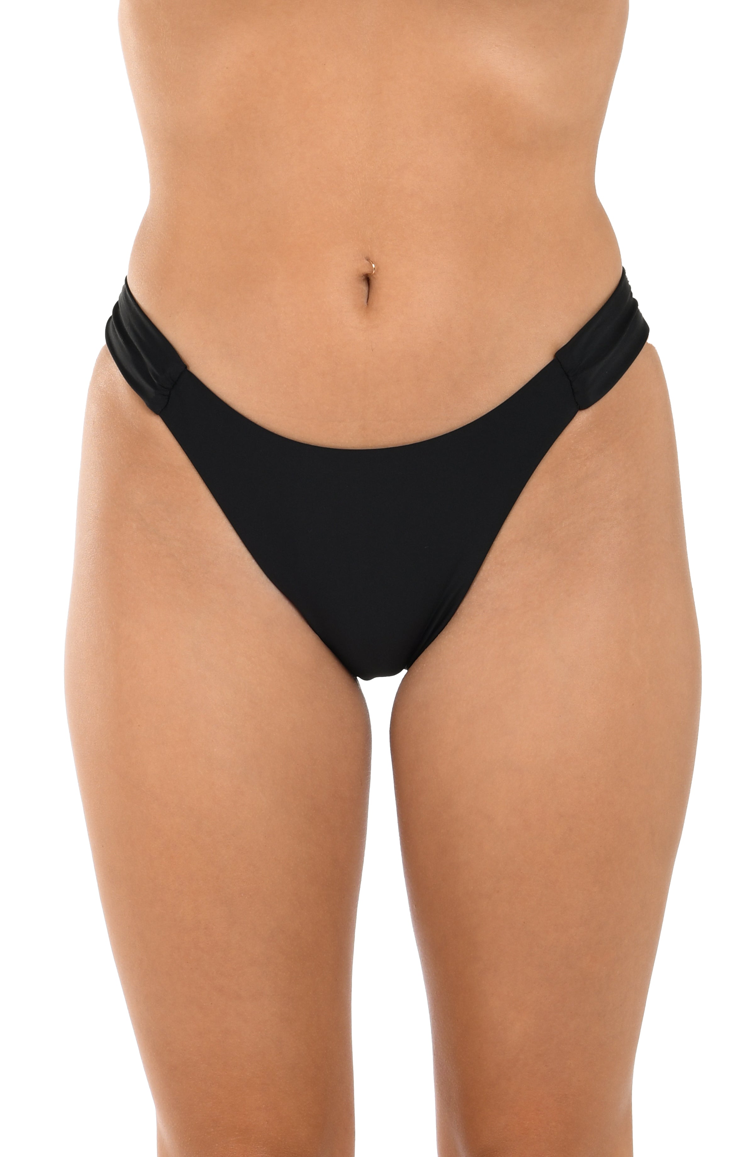 Black bikini bottom worn by a person on a white background