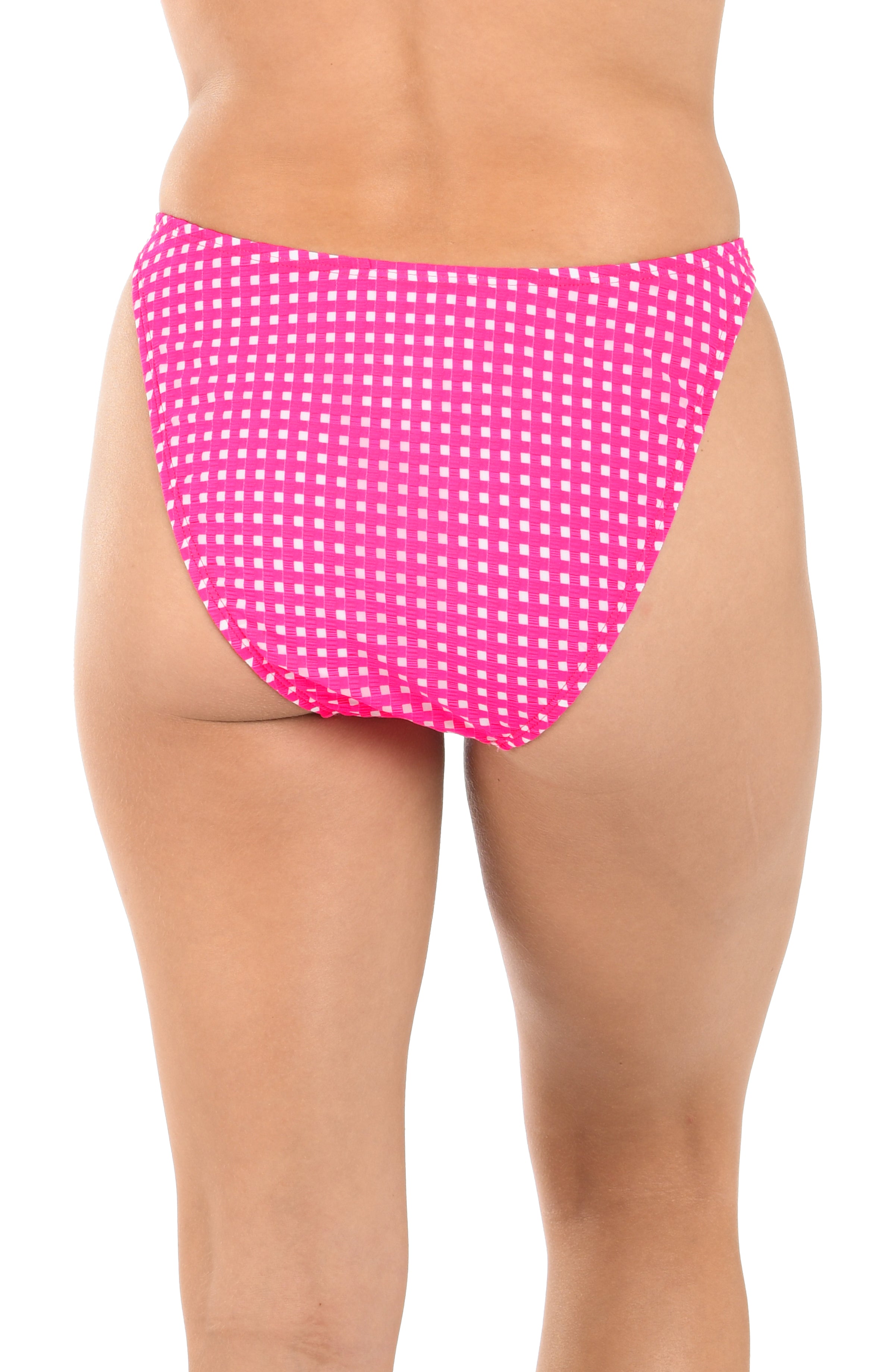 Pink polka dot bikini bottom on a white background