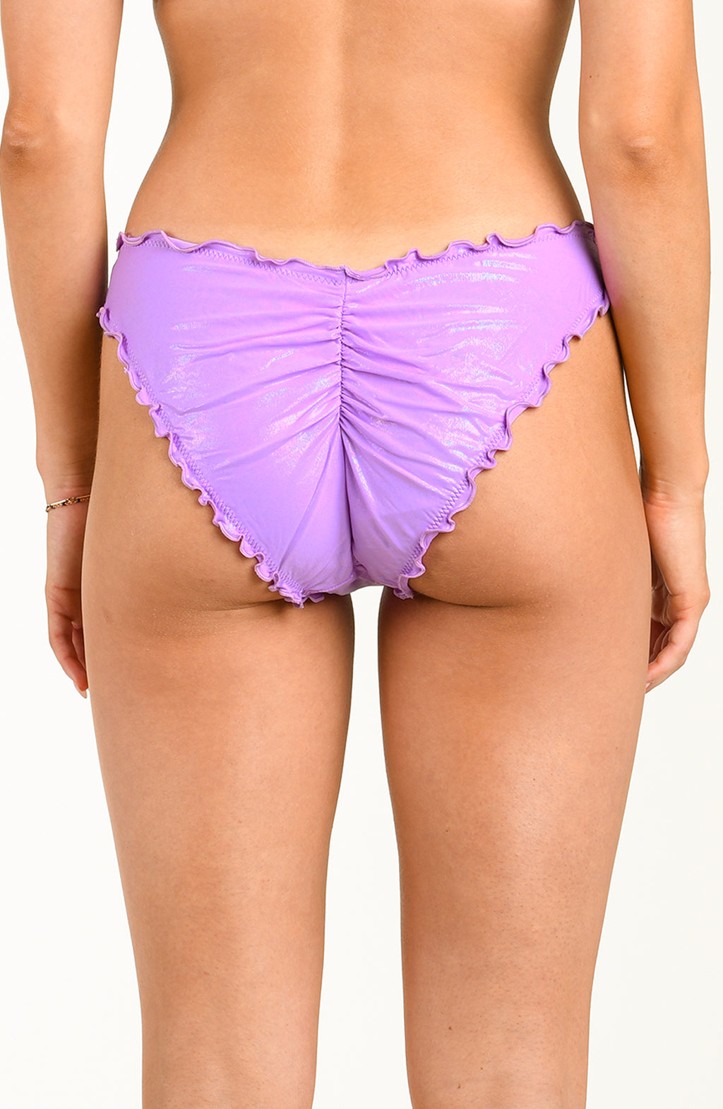 Purple ruched underwear on a plain background
