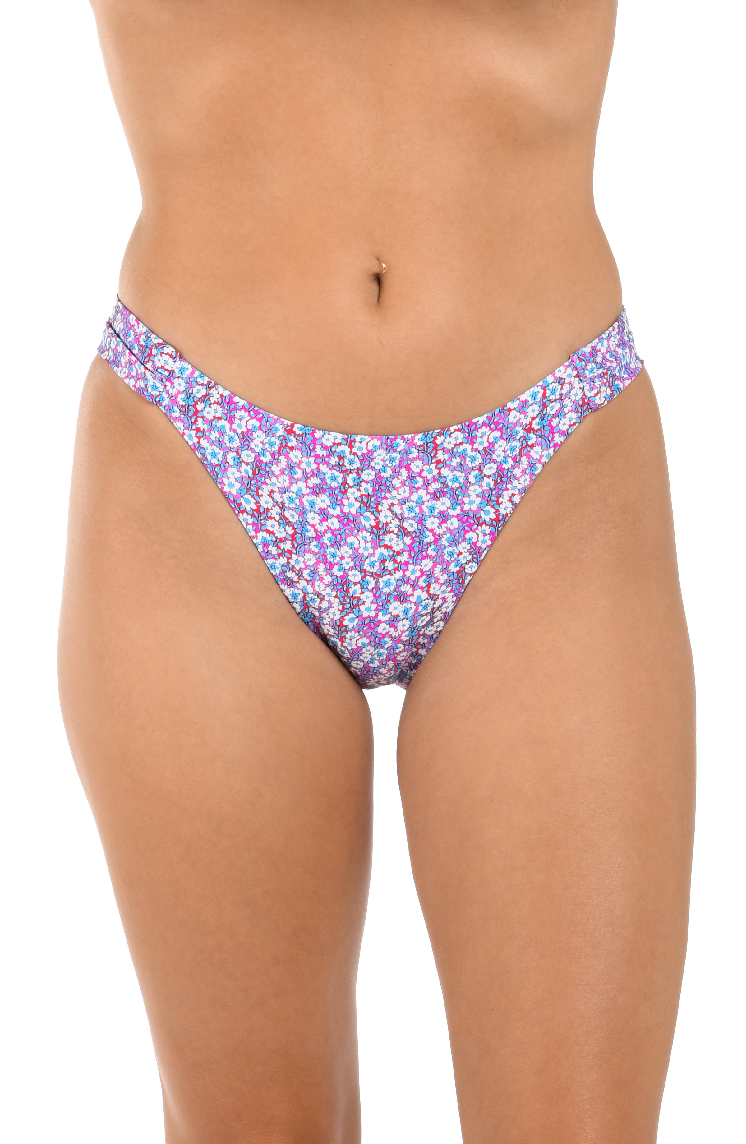 Purple floral bikini bottom worn by a person on a white background