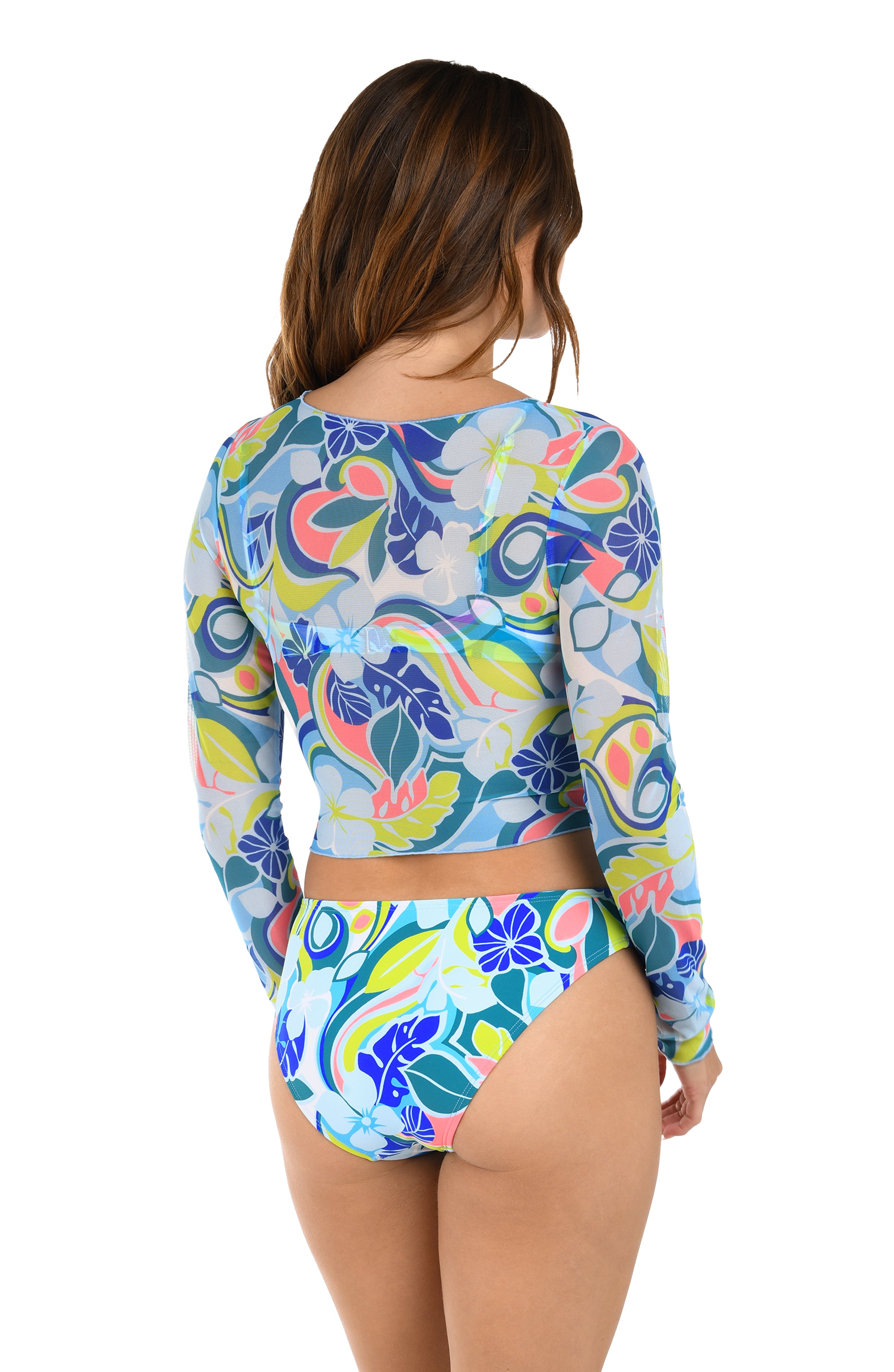 Woman wearing a colorful long-sleeve top and matching bottom with a floral pattern on a white background
