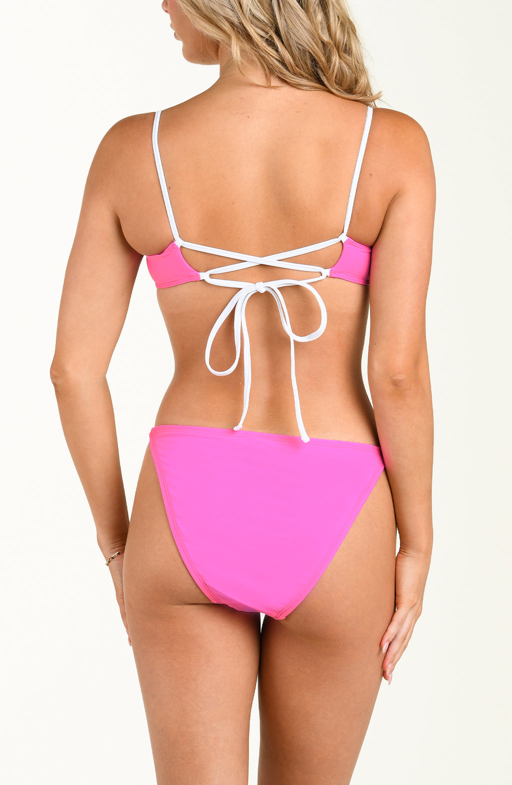 Pink bikini with white straps on a white background