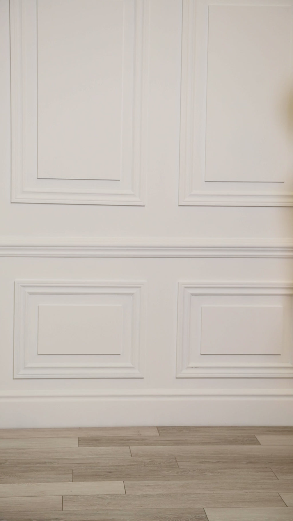 Video of a woman wearing a multicolored (white) tropical one-piece. 