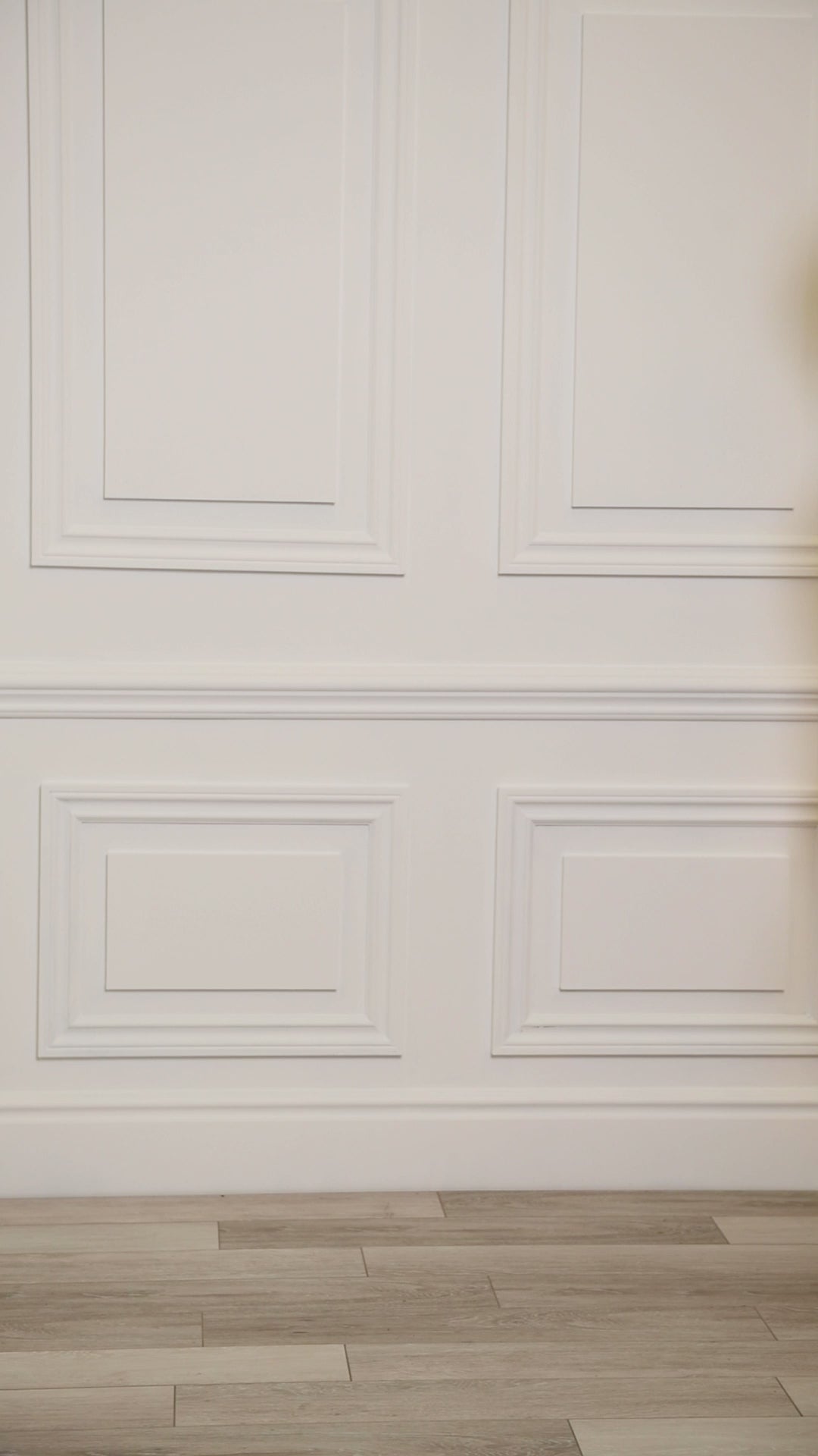 Video of a woman wearing a multicolored (white) tropical one-piece. 