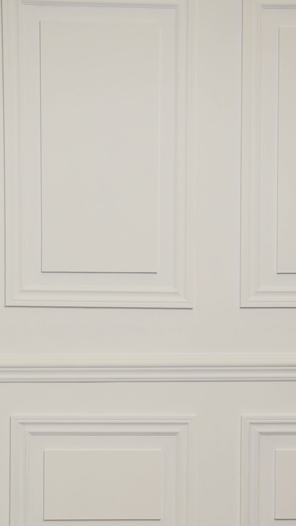 Video of woman wearing a multicolored white and blue tropical one-piece swimsuit.