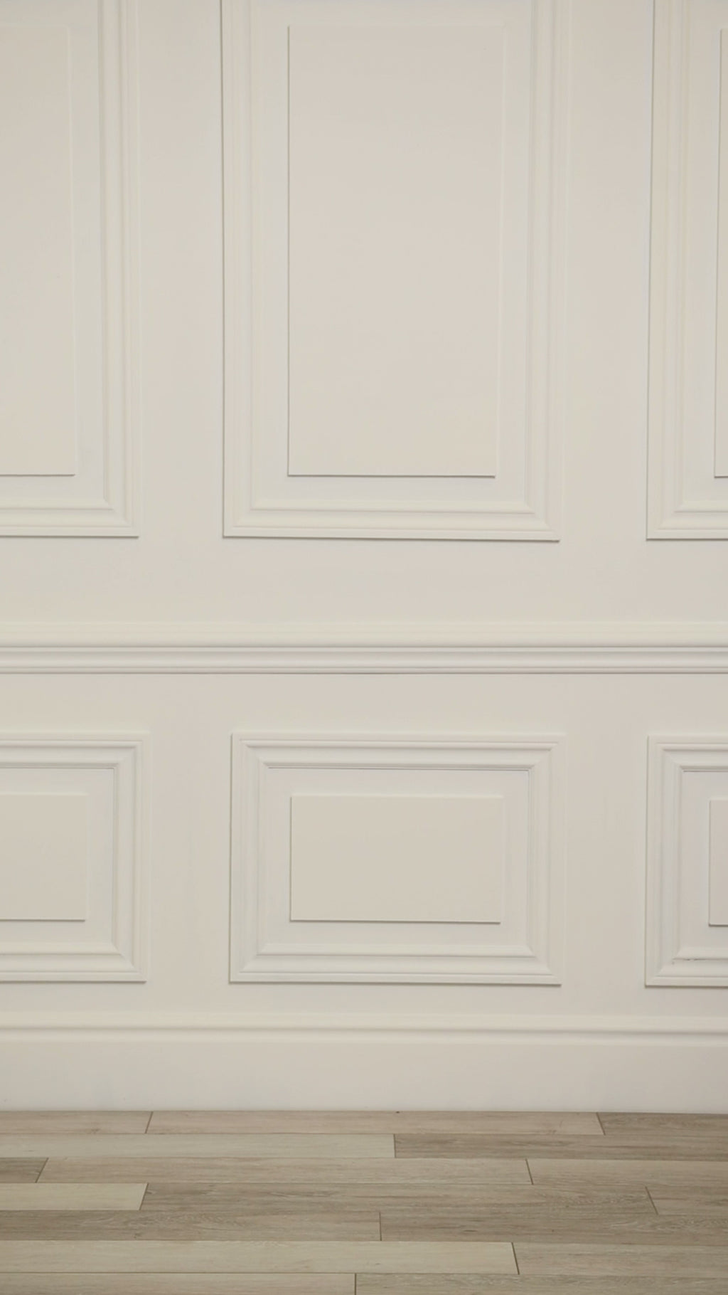 Video of a woman wearing a multicolored (white) tropical tunic cover up. 