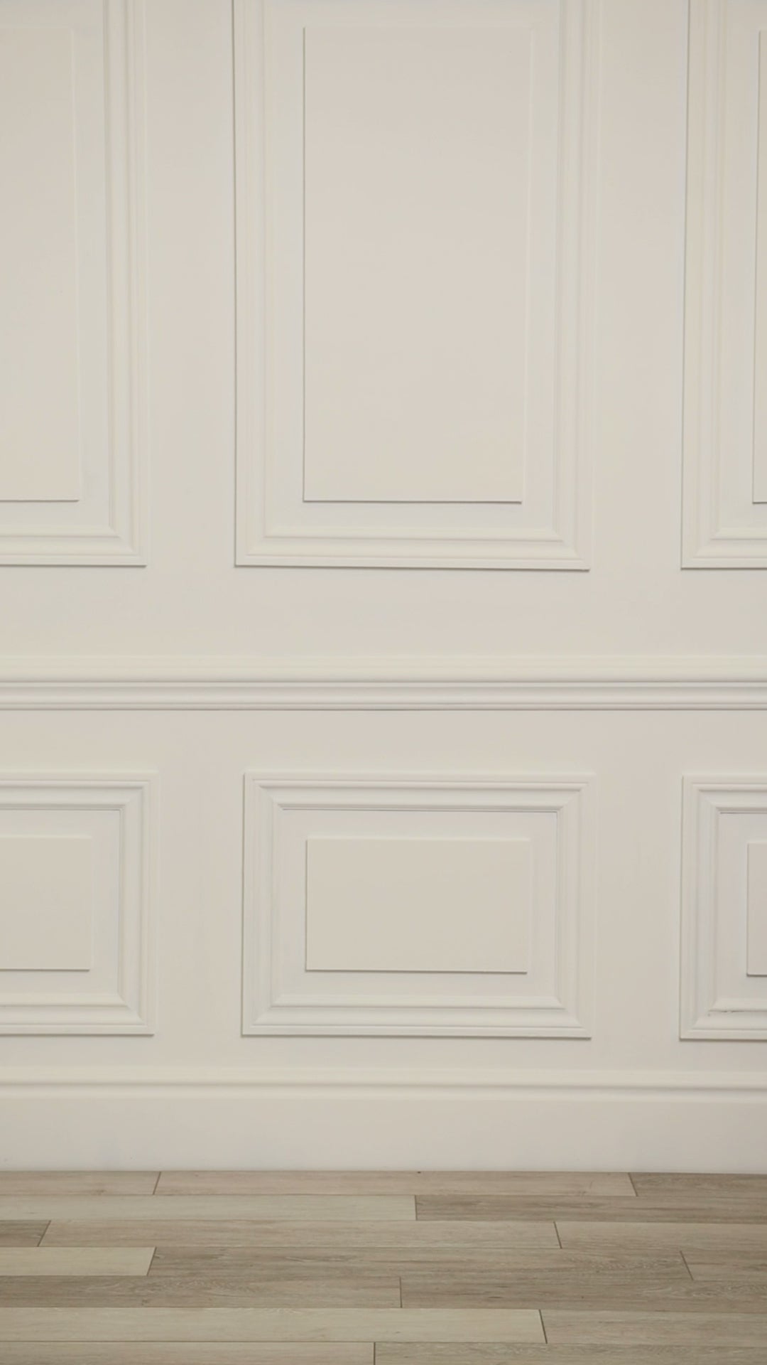 Video of a woman wearing a multicolored (white) tropical tunic cover up. 