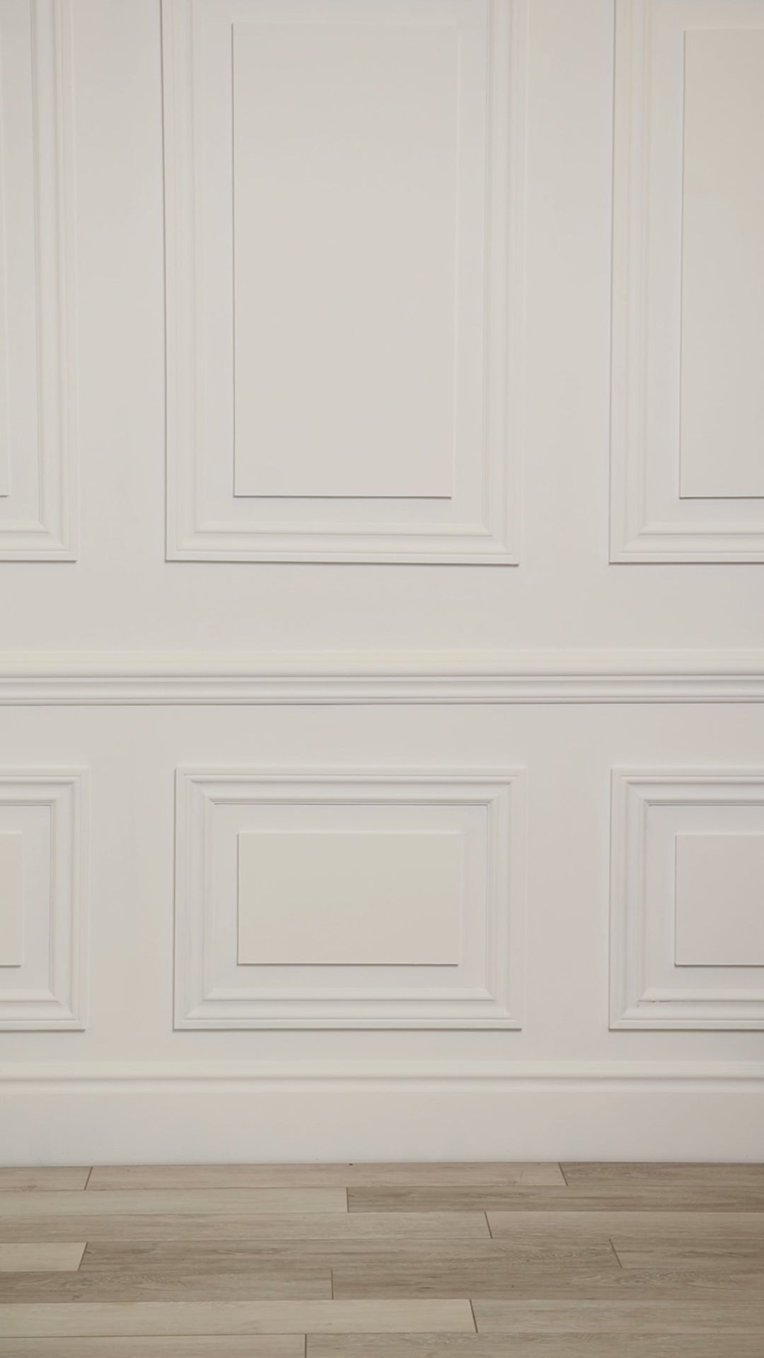 Video of a woman wearing a multicolored (blue) tropical one-piece swim dress. 