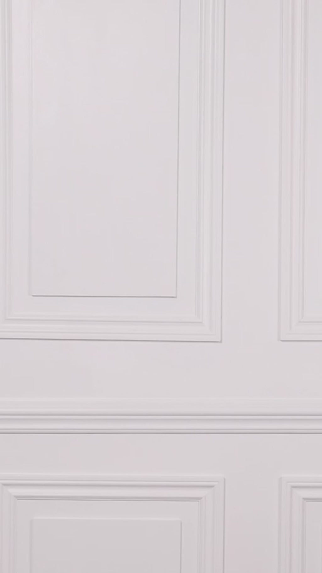 Video of a woman wearing a black floral swim dress with a white background