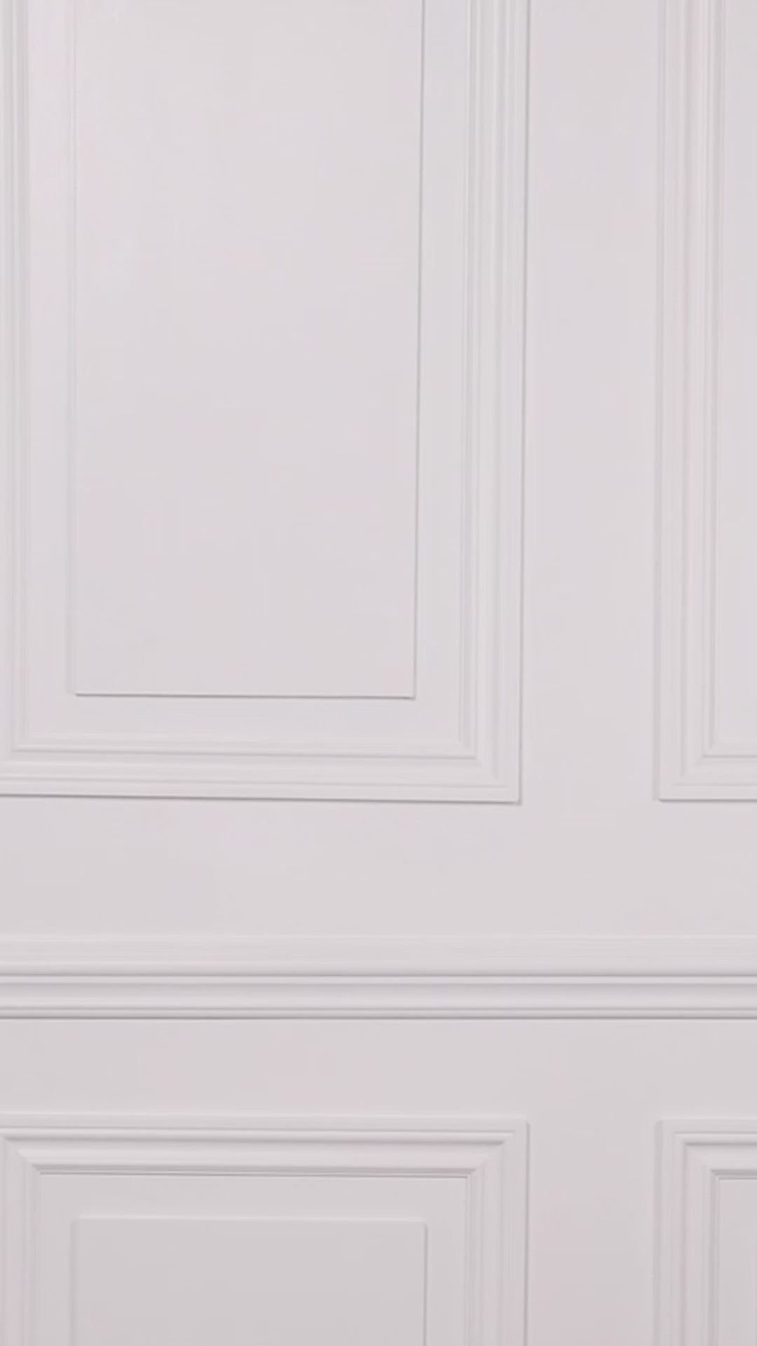 Video of a woman wearing a black floral swim dress with a white background