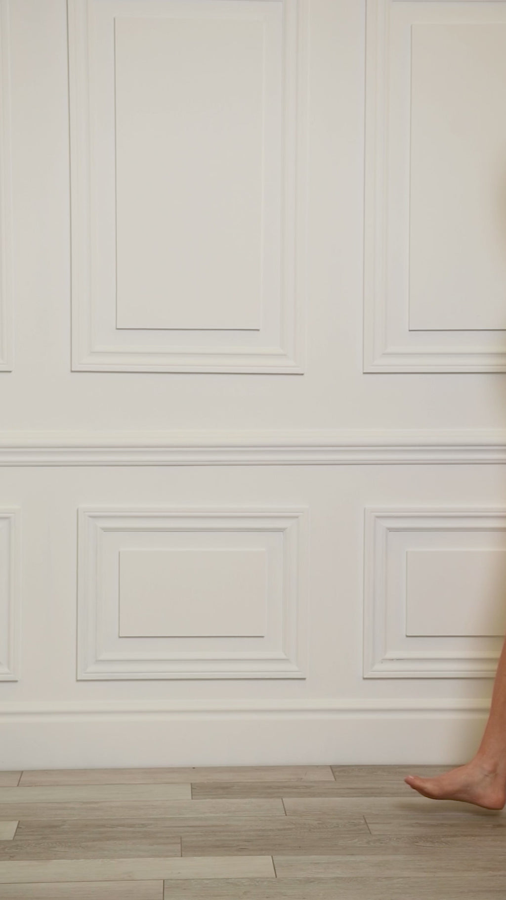 Video of a woman wearing a multicolored teal colored one-piece.