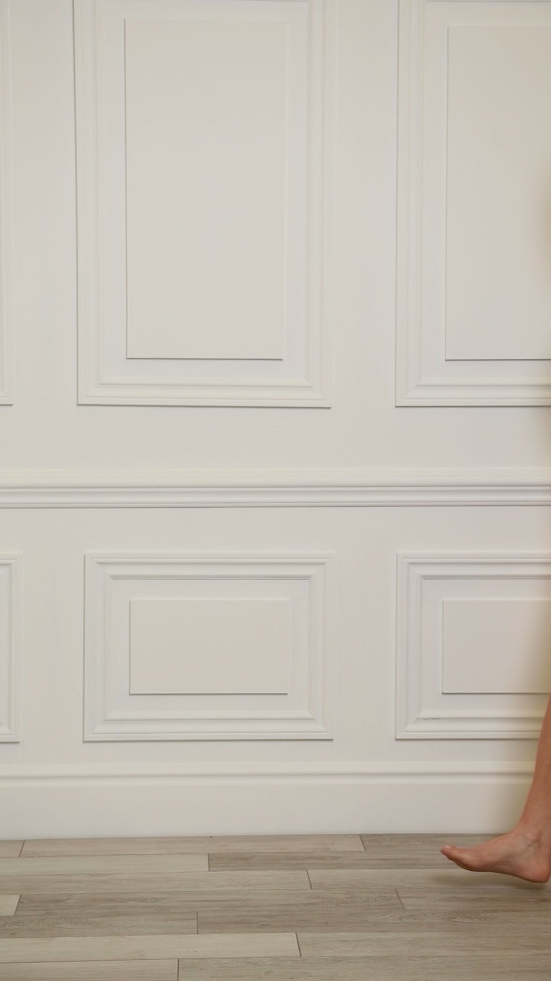 Video of a woman wearing a multicolored teal colored one-piece.