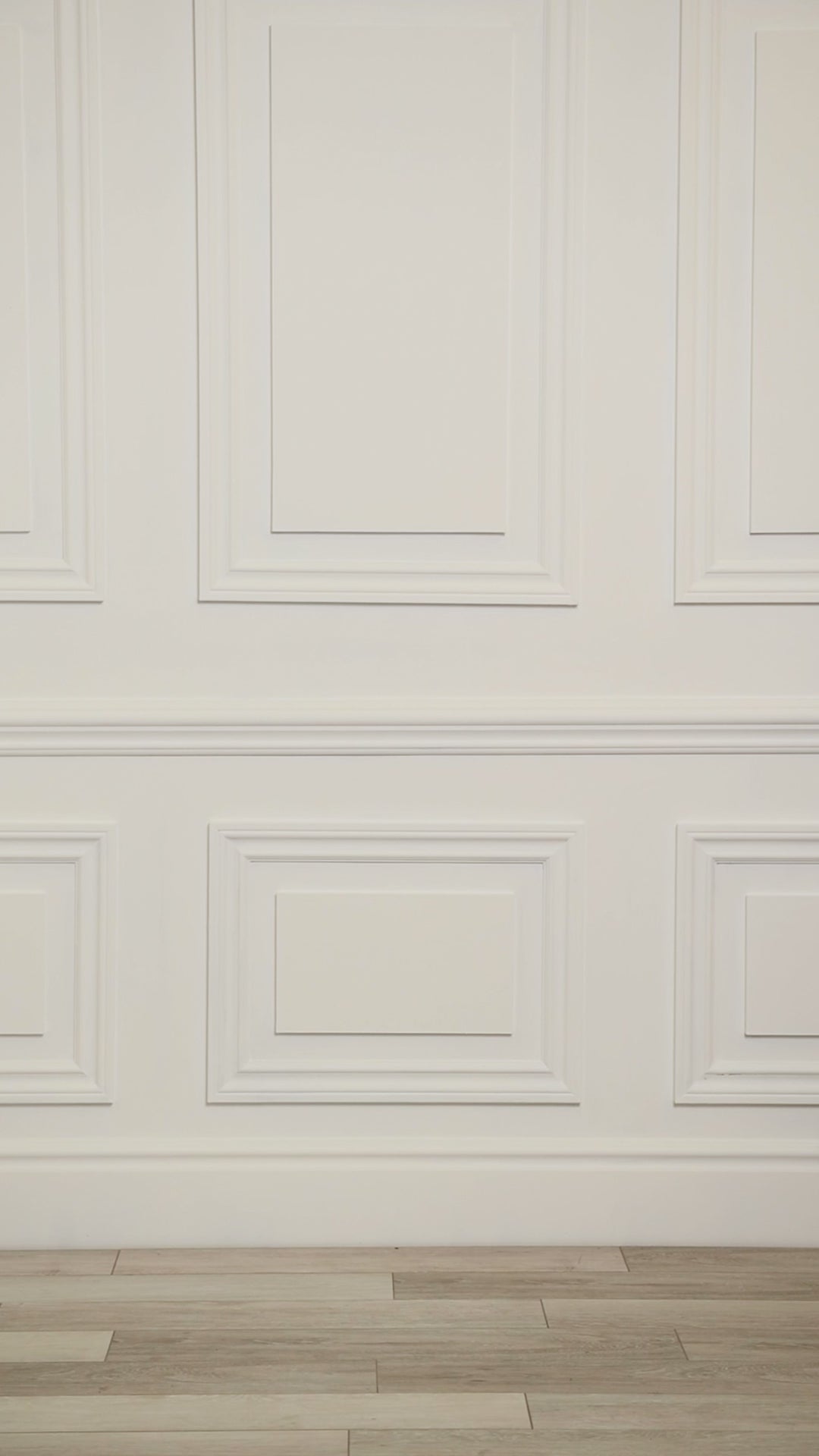 Video of a woman wearing a multicolored (white) tropical one-piece.